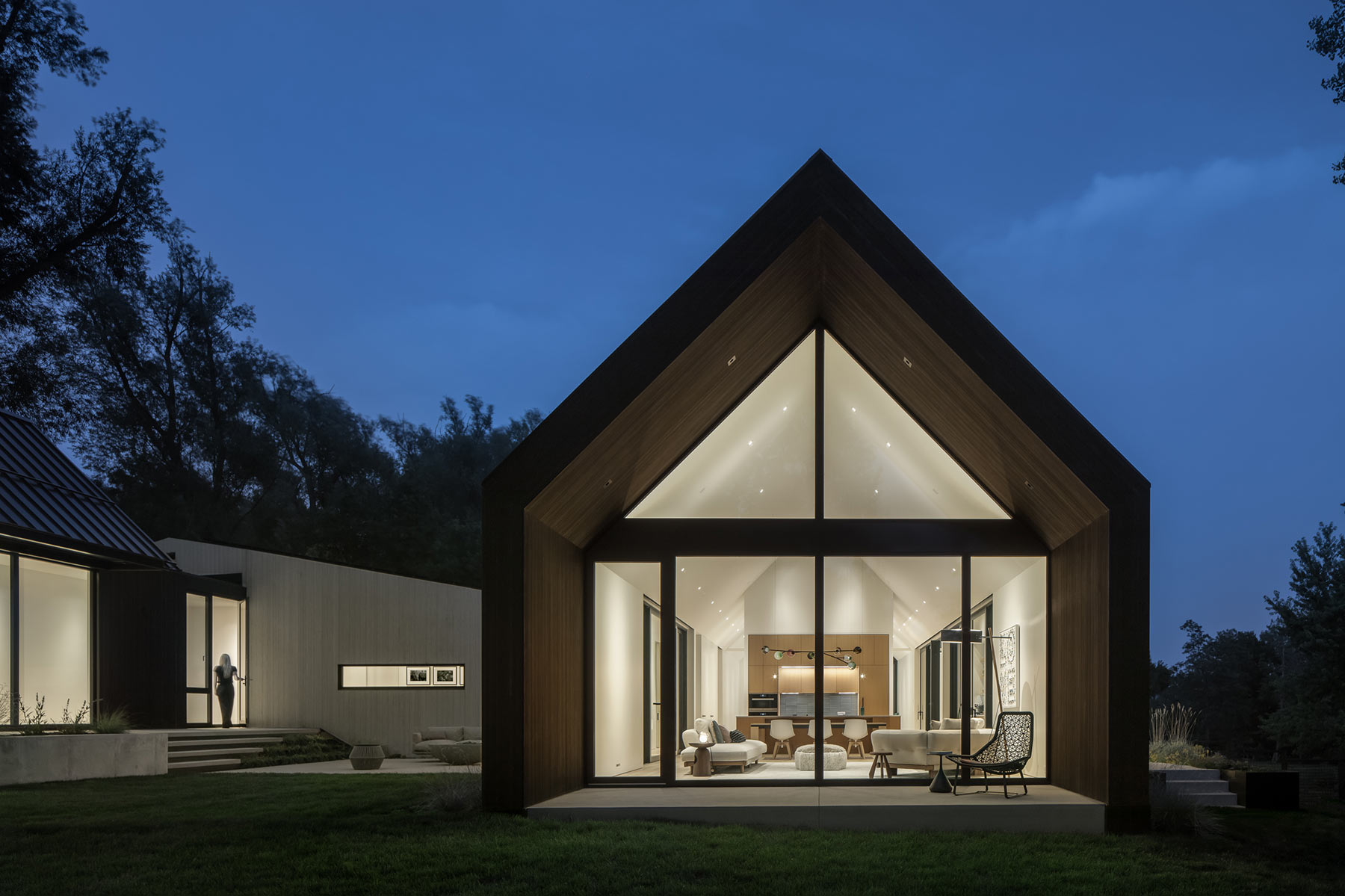 Modern home in Boulder with large windows one of three gabeled wings.